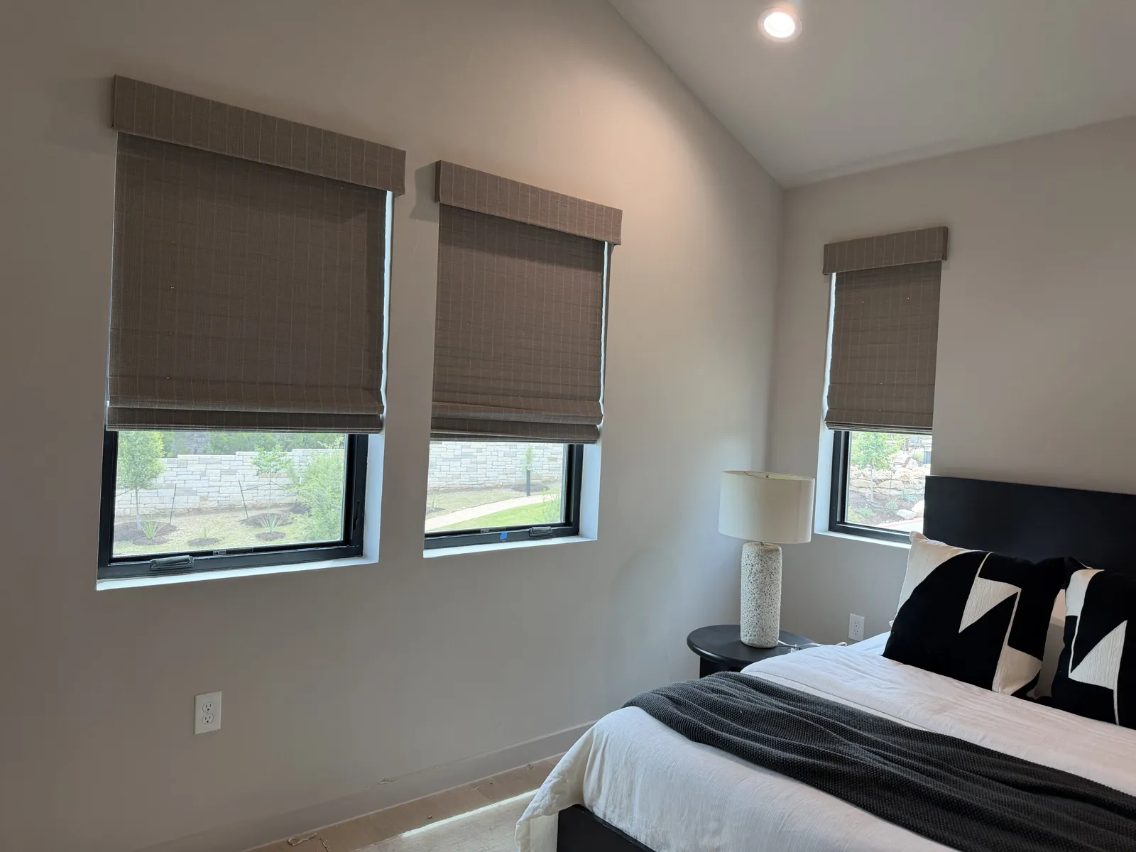 Bedroom with dual-layer zebra shades on two windows